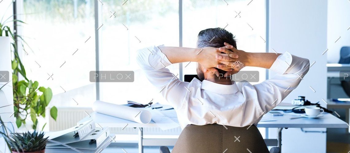 demo-attachment-112-Businessman-at-the-desk-in-his-office-resting.